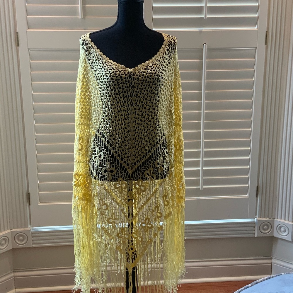 Yellow crochet poncho with fringe